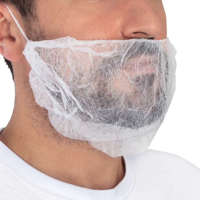 Gros plan d'une personne portant un "Pack de 100 Couvre-Barbe", un couvre-barbe blanc jetable pour l'hygiène dans la préparation des aliments ou dans les milieux médicaux, fixé autour des oreilles et s'ajustant parfaitement à la barbe.