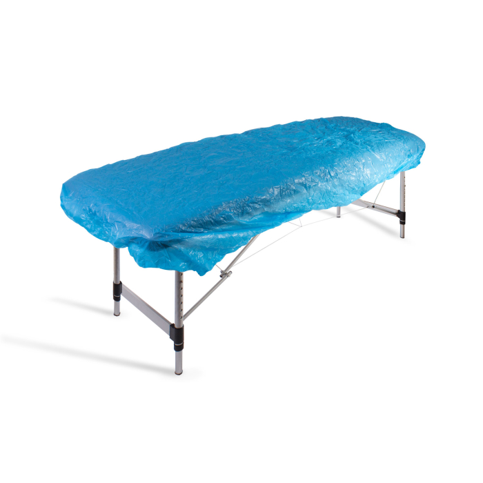 Blue elasticated bed cover fitted on portable massage table isolated on white background
