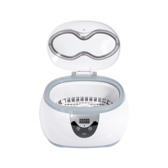 Le nettoyeur ultrasonique 600 ml (EU Lead) est un appareil blanc doté d’un écran numérique et d’un couvercle transparent ouvert, laissant apparaître un panier dans la chambre de nettoyage circulaire.